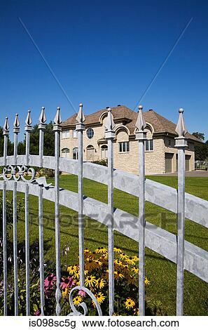 Large house behind gate View Large Photo Image Stock Image - Large house behind gate. Fotosearch