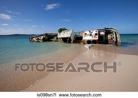 Stock Image - Shipwreck on remote island.. Fotosearch