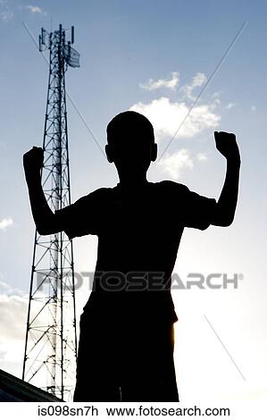 Stock Image - Silhouette of young boy.. Fotosearch