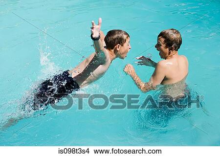 Picture - Boys playing in swimming pool, Auckland. Fotosearch