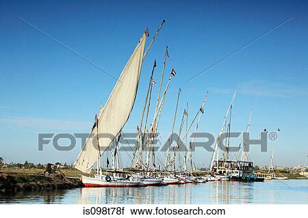 Stock Image - Felucca boats on river nile at luxor. Fotosearch