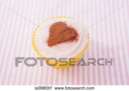Heart shape on cupcake View Large Photo Image Stock Photo - Heart shape on cupcake. Fotosearch