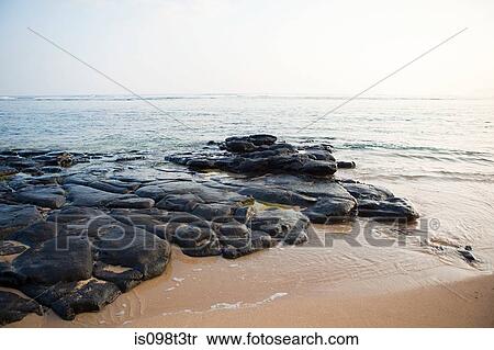 Rocks on hawaiian beach View Large Photo Image Stock Photography - Rocks on hawaiian beach. Fotosearch