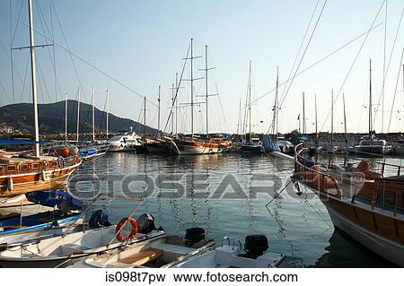 Stock Photo - Sailboats in kalkan harbour, turkey. Fotosearch