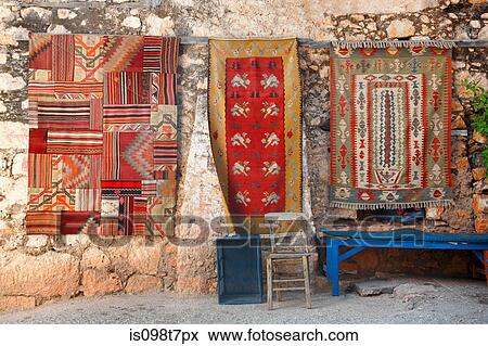Turkish rugs on wall in simena View Large Photo Image Stock Photo - Turkish rugs on wall in simena. Fotosearch