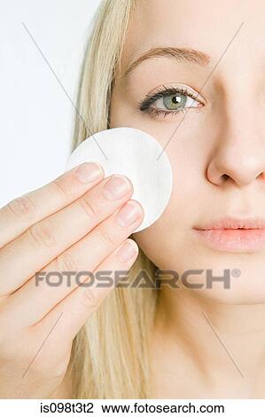 Young woman cleansing face View Large Photo Image Stock Image - Young woman cleansing face. Fotosearch