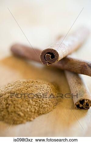 Ground cinnamon and cinnamon sticks View Large Photo Image Stock Photo - Ground cinnamon and cinnamon sticks. Fotosearch