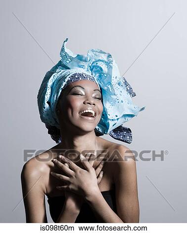 Happy young woman wearing head tie View Large Photo Image Picture - Happy young woman wearing head tie. Fotosearch