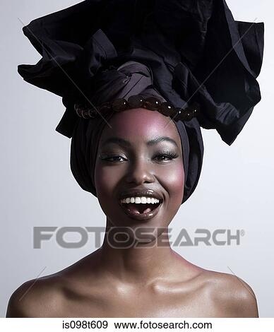 Happy young woman wearing head tie View Large Photo Image Stock Photo - Happy young woman wearing head tie. Fotosearch