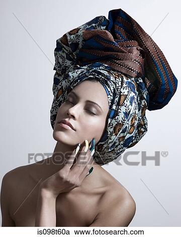 Young woman wearing head tie and artificial nails View Large Photo Image Stock Image - Young woman wearing head tie and artificial nails. Fotosearch