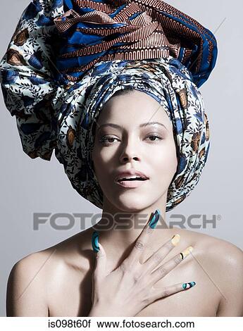 Young woman wearing head tie and artificial nails View Large Photo Image Stock Image - Young woman wearing head tie and artificial nails. Fotosearch