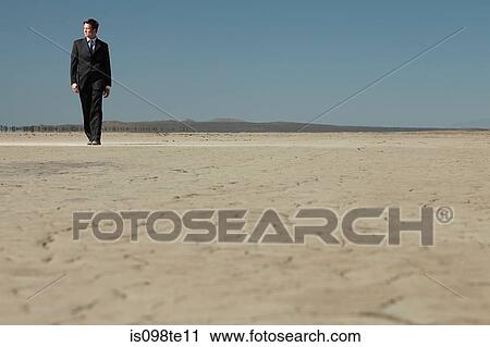 Businessman in desert View Large Photo Image Stock Image - Businessman in desert. Fotosearch