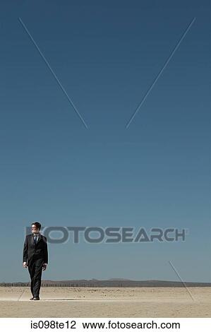 Businessman in desert View Large Photo Image Stock Image - Businessman in desert. Fotosearch