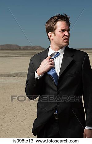 Businessman in desert View Large Photo Image Stock Image - Businessman in desert. Fotosearch
