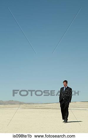Businessman in desert View Large Photo Image Stock Image - Businessman in desert. Fotosearch