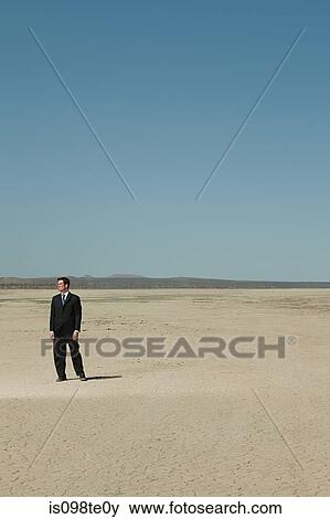 Businessman in desert View Large Photo Image Stock Photo - Businessman in desert. Fotosearch