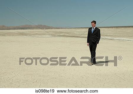 Businessman in desert View Large Photo Image Stock Photo - Businessman in desert. Fotosearch