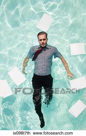 Office worker in swimming pool View Large Photo Image Stock Image - Office worker in swimming pool. Fotosearch