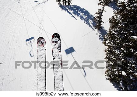 Skis of skier on ski lift View Large Photo Image Stock Photo - Skis of skier on ski lift. Fotosearch