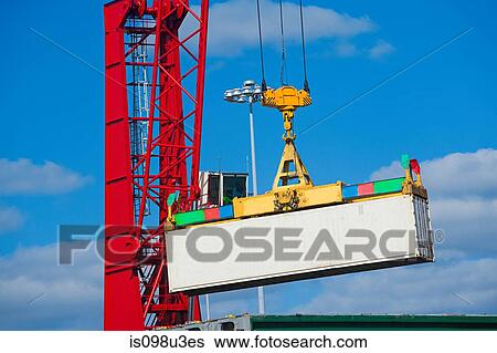 Crane lifting cargo container View Large Photo Image Stock Photograph - Crane lifting cargo container. Fotosearch