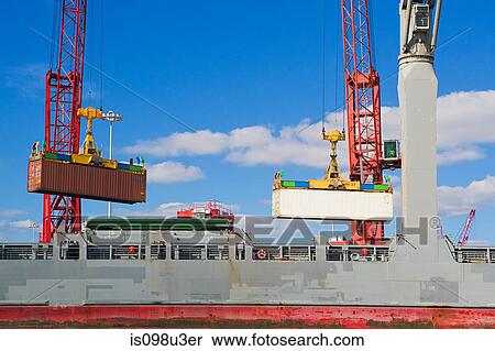 Cranes lifting cargo containers View Large Photo Image Stock Photography - Cranes lifting cargo containers. Fotosearch