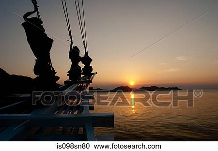 Sailing vessel at sunset. View Large Photo Image Stock Image - Sailing vessel at sunset.. Fotosearch