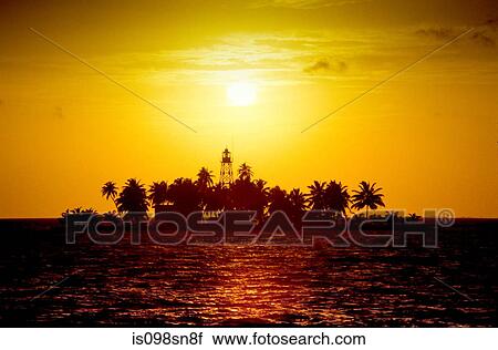 Stock Image - Sunset over island.. Fotosearch