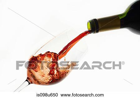 Bottle of red wine being poured into wine glass and splashing View Large Photo Image Stock Image - Bottle of red wine being poured into wine glass and splashing. Fotosearch