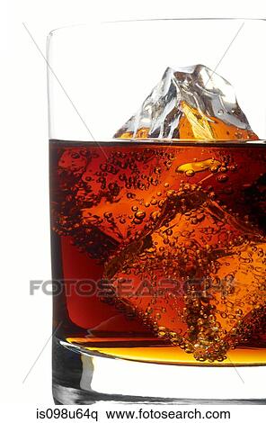 Whiskey and cola in a tumbler with ice cubes View Large Photo Image Stock Photography - Whiskey and cola in a tumbler with ice cubes. Fotosearch