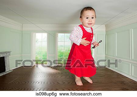 Big toddler girl in a tiny room with a key View Large Photo Image Stock Image - Big toddler girl in a tiny room with a key. Fotosearch