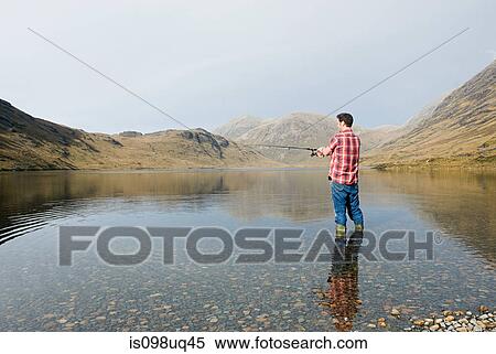 Man fishing in lake View Large Photo Image Stock Photography - Man fishing in lake. Fotosearch