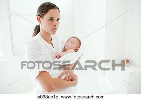 Mother and baby son wrapped in towel View Large Photo Image Stock Image - Mother and baby son wrapped in towel. Fotosearch
