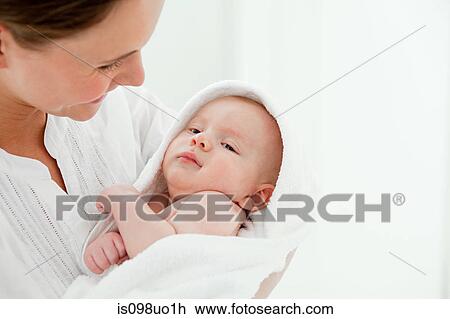 Mother and baby son wrapped in towel View Large Photo Image Stock Image - Mother and baby son wrapped in towel. Fotosearch