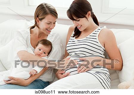 Mother with baby and pregnant friend View Large Photo Image Stock Image - Mother with baby and pregnant friend. Fotosearch