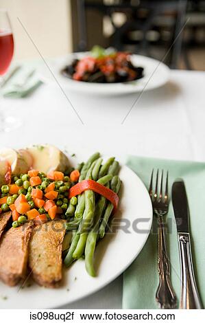 Meals on a table View Large Photo Image Stock Image - Meals on a table. Fotosearch
