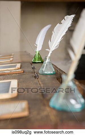 Quill Pens And Inkwells On Old Fashioned Desks Stock Image