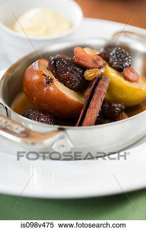 Apple, raisin and cinnamon desert View Large Photo Image Stock Photography - Apple, raisin and cinnamon desert. Fotosearch