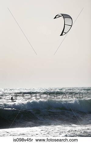 Stock Photography - Man kitesurfing. Fotosearch