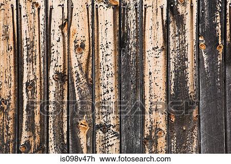 Stock Image - Paint peeling off wood, close up. Fotosearch