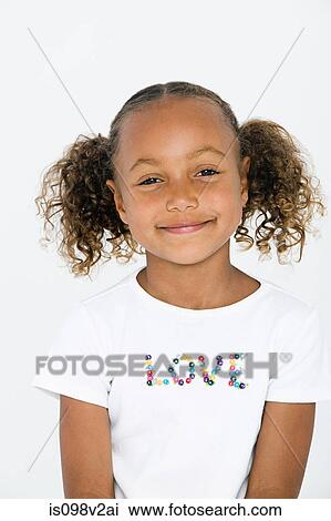 Stock Image - Portrait of girl wearing white t shirt with love written on it. Fotosearch