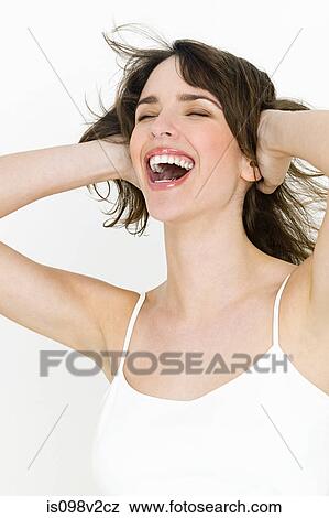 Portrait of young brunette woman covering ears View Large Photo Image Stock Photo - Portrait of young brunette woman covering ears. Fotosearch