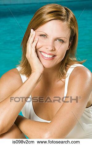 Portrait of young woman at poolside View Large Photo Image Picture - Portrait of young woman at poolside. Fotosearch