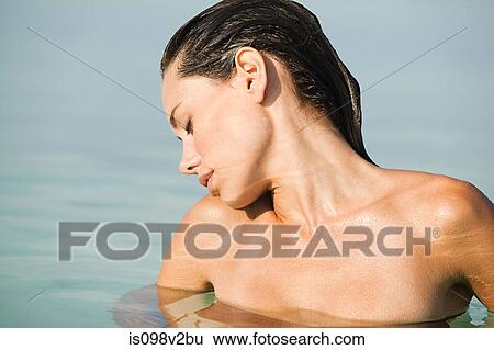 Topless young woman in sea View Large Photo Image Stock Photograph - Topless young woman in sea. Fotosearch