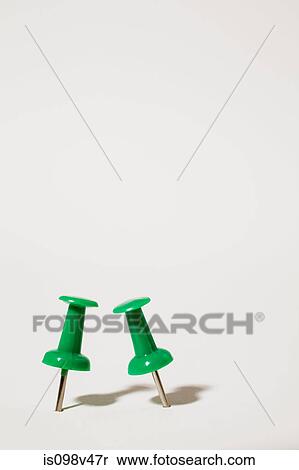 Two green thumbtacks View Large Photo Image Stock Photography - Two green thumbtacks. Fotosearch