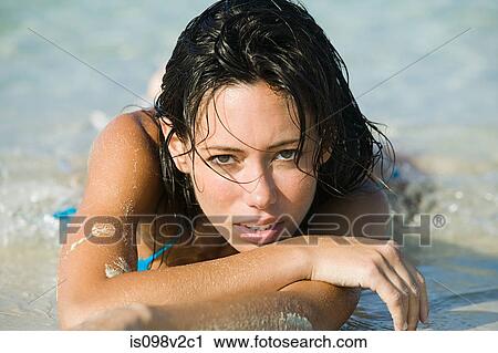 Young sexy woman lying on beach View Large Photo Image Stock Image - Young sexy woman lying on beach. Fotosearch