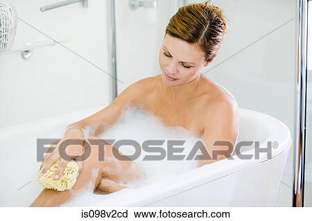 Young woman having a bath View Large Photo Image Stock Image - Young woman having a bath. Fotosearch