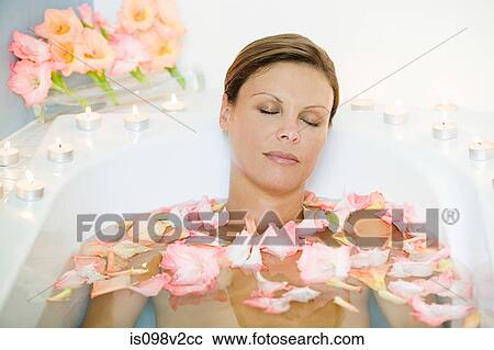 Young woman in bath with petals View Large Photo Image Stock Image - Young woman in bath with petals. Fotosearch