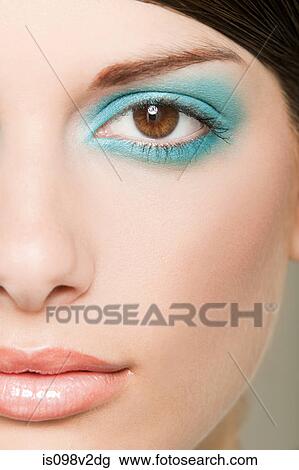 Young woman with turquoise eyeshadow View Large Photo Image Stock Image - Young woman with turquoise eyeshadow. Fotosearch