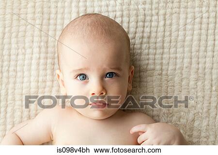 Stock Image - Baby boy lying on back. Fotosearch