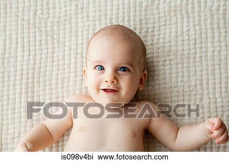 Stock Image - Baby boy lying on back. Fotosearch